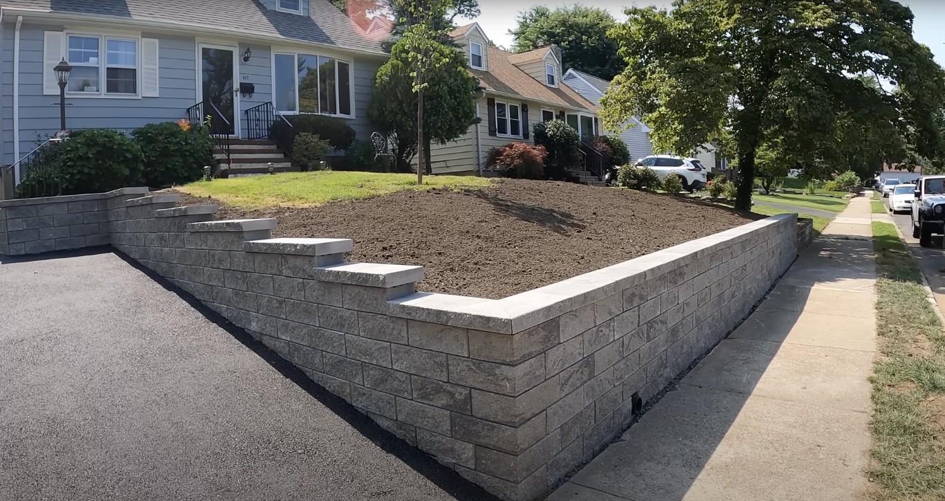 Retaining wall and concrete masonry construction